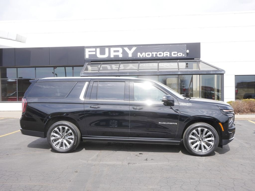 2025 Chevrolet Suburban High Country in Black — front three-quarter view