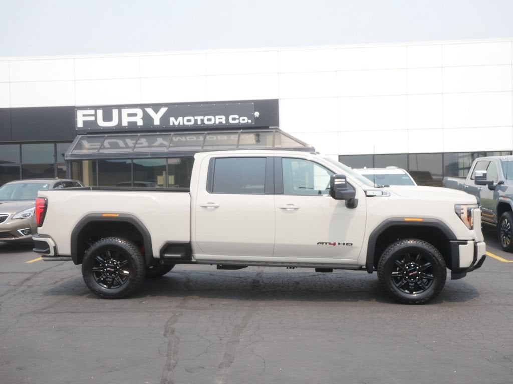 2026 GMC Sierra 3500 HD AT4 in Coastal Dune — front three-quarter view