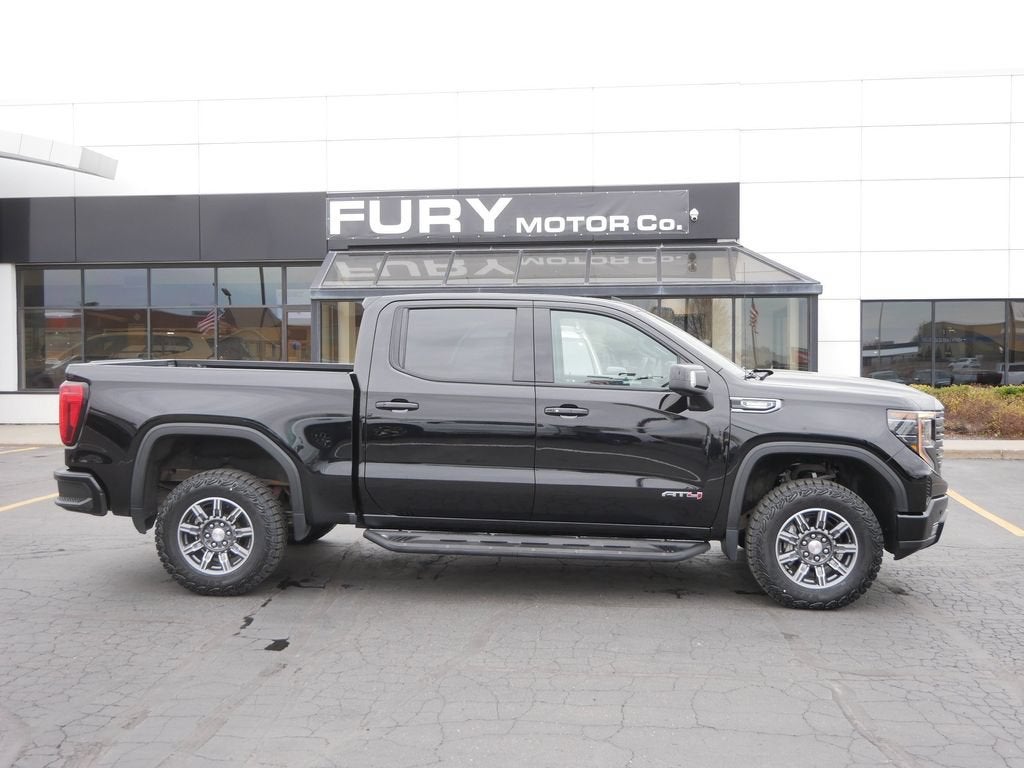 2024 GMC Sierra 1500 AT4 in Onyx Black — front three-quarter view