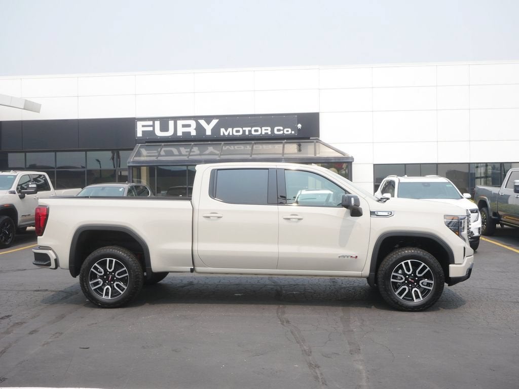 2026 GMC Sierra 1500 AT4 in Coastal Dune — front three-quarter view
